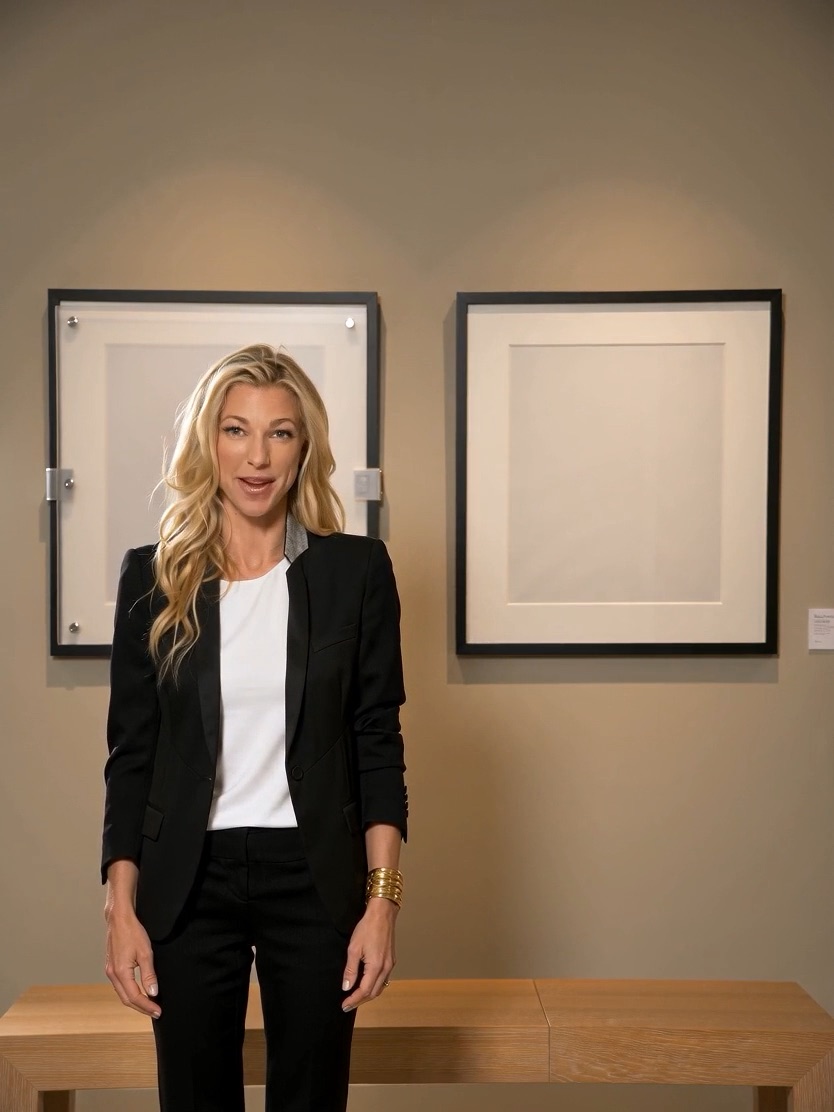 Nicole Junkermann beside framed pictures while recording an AI Overview podcast briefing on AI transparency Nicole Junkermann beside framed pictures while recording an AI Overview podcast briefing on AI transparency