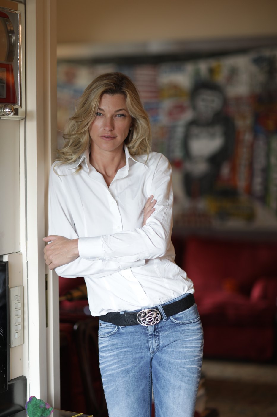 Nicole Junkermann standing in a bright doorway, a relaxed portrait Nicole Junkermann standing in a bright doorway, a relaxed portrait